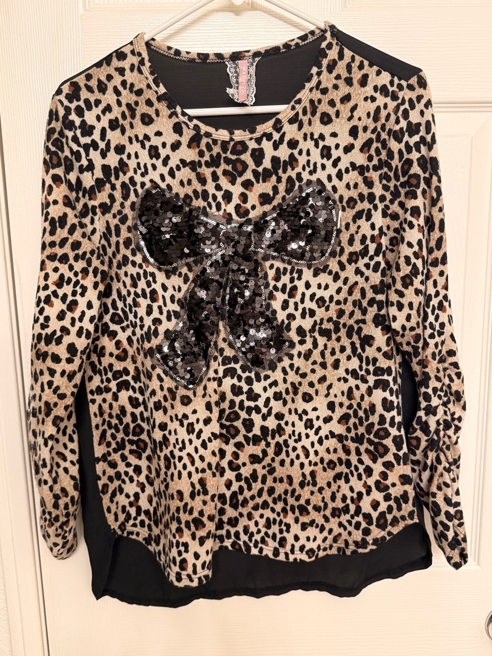 Mauve Leopard Print Top with Black Accents
Sheer back